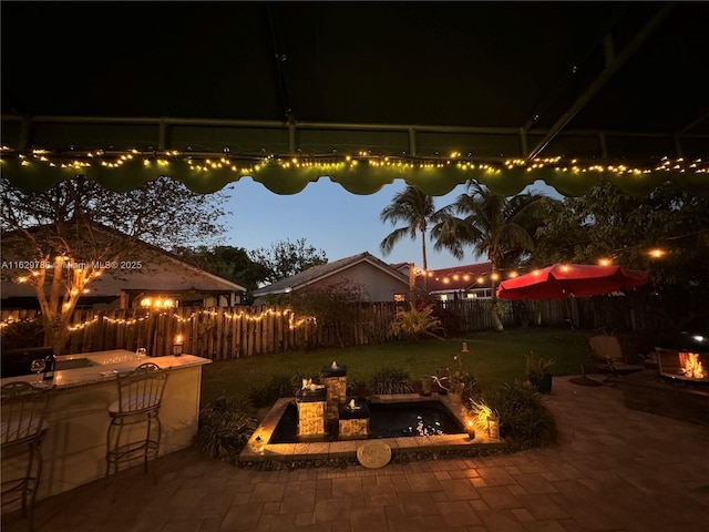 patio at night with an outdoor bar