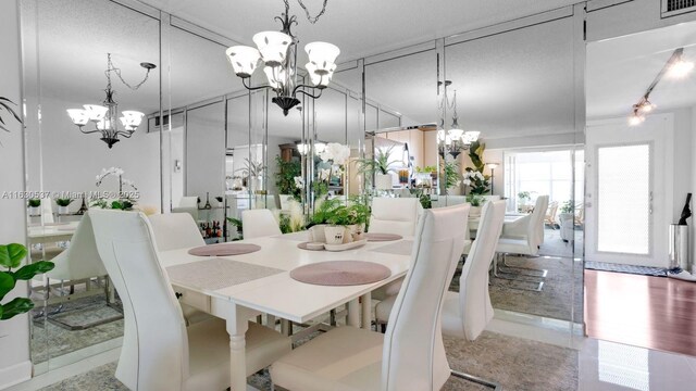 dining space featuring a textured ceiling