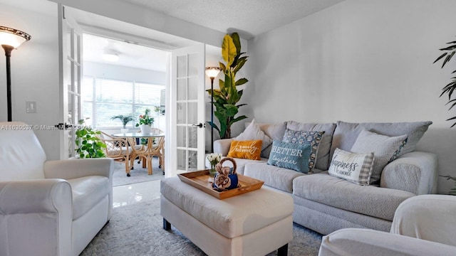 carpeted living room with a textured ceiling