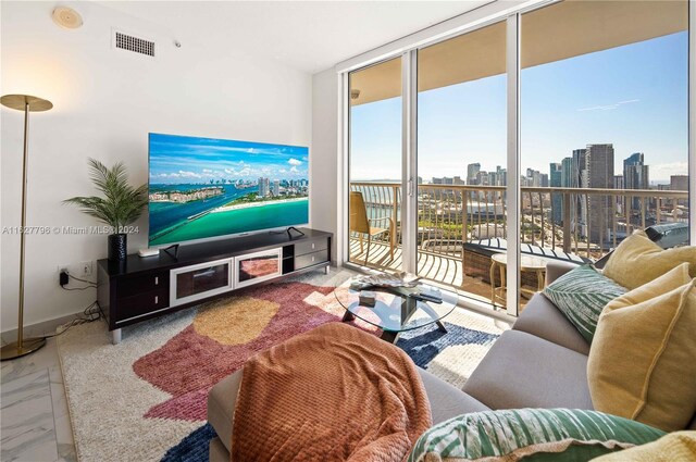 tiled living room with a wealth of natural light and a wall of windows