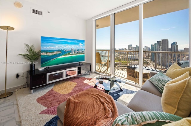 living room featuring floor to ceiling windows