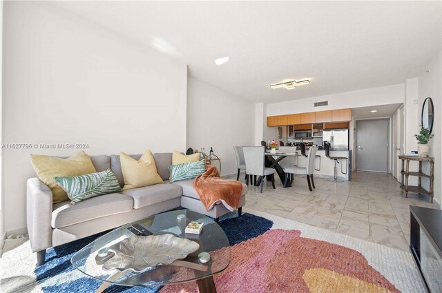 living room with light tile patterned flooring