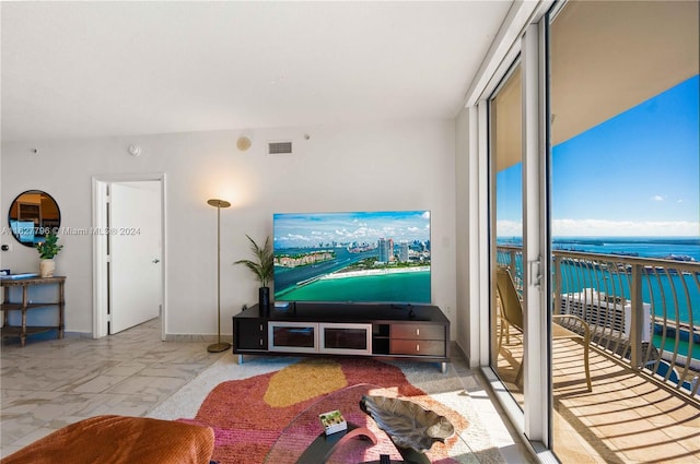 living room featuring a wall of windows