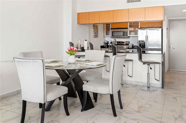 dining room with light tile patterned floors