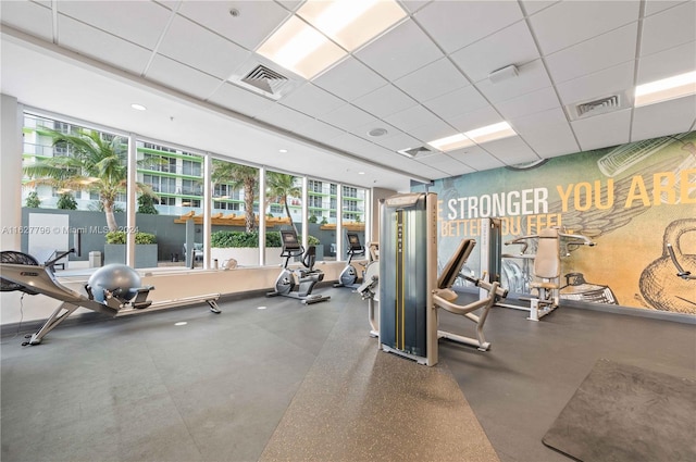 workout area with a paneled ceiling