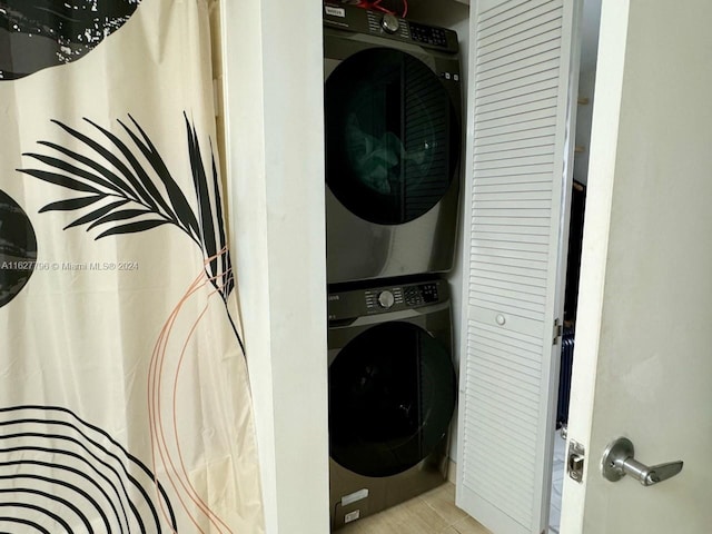 washroom with stacked washer and clothes dryer