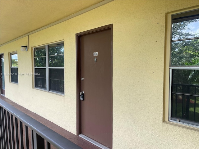 doorway to property featuring a balcony