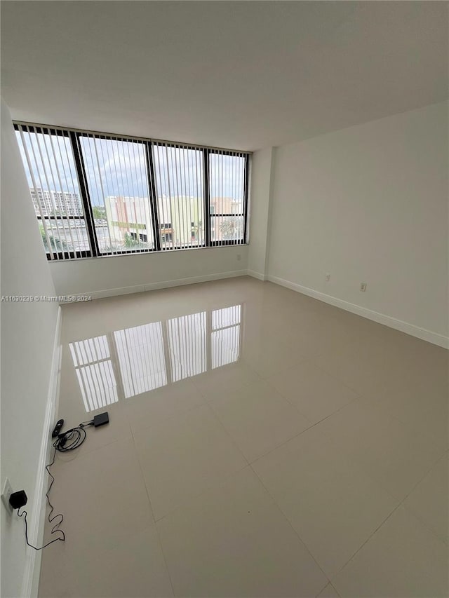 empty room with tile patterned flooring