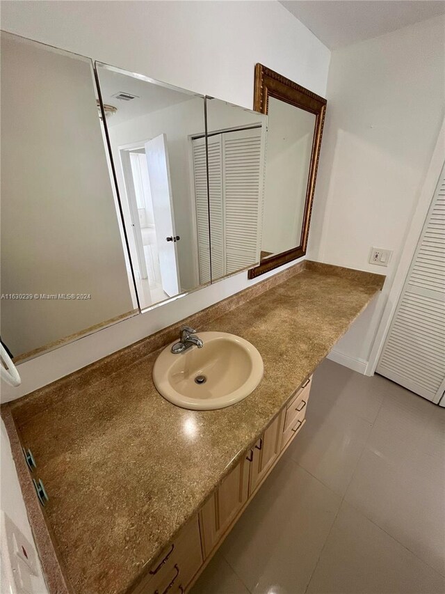 bathroom featuring vanity and tile patterned floors