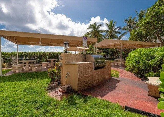 view of patio featuring exterior kitchen and grilling area