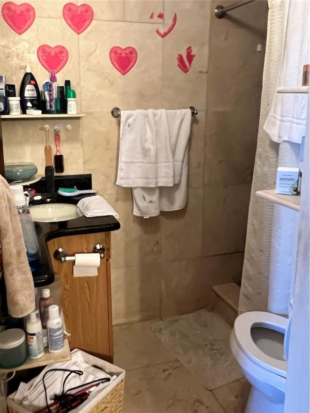 bathroom with toilet and tile patterned floors