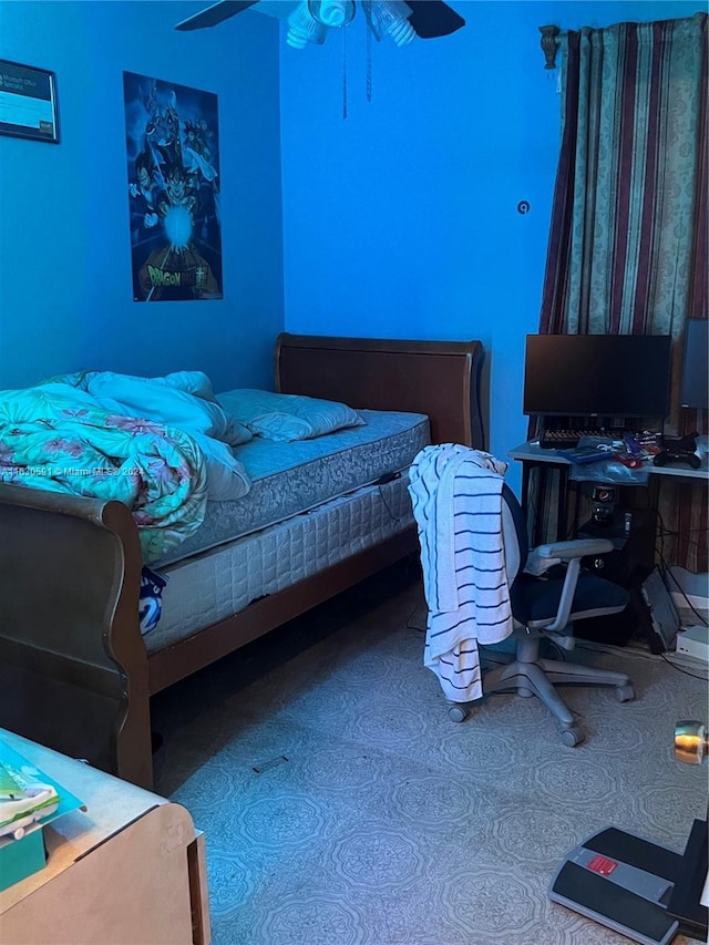 carpeted bedroom featuring ceiling fan