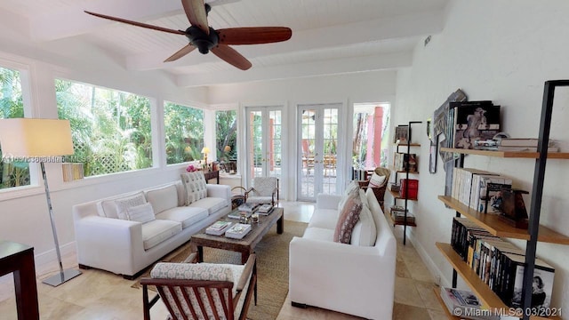 tiled living room featuring beam ceiling and ceiling fan