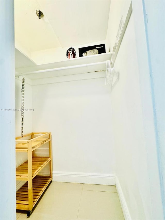 spacious closet featuring tile patterned floors