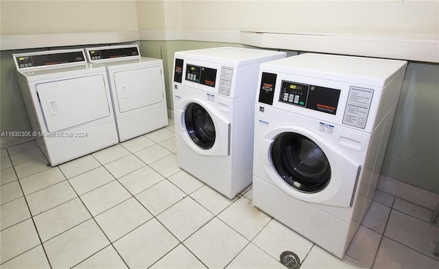 laundry room with light tile patterned floors and independent washer and dryer