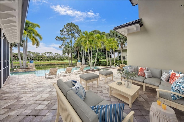 view of patio / terrace featuring a water view and an outdoor hangout area