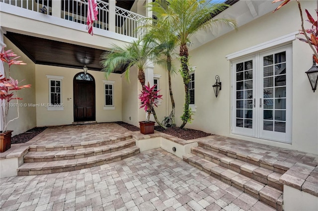 entrance to property featuring a patio area and french doors