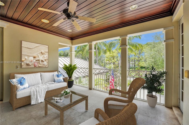 sunroom / solarium with wooden ceiling and ceiling fan