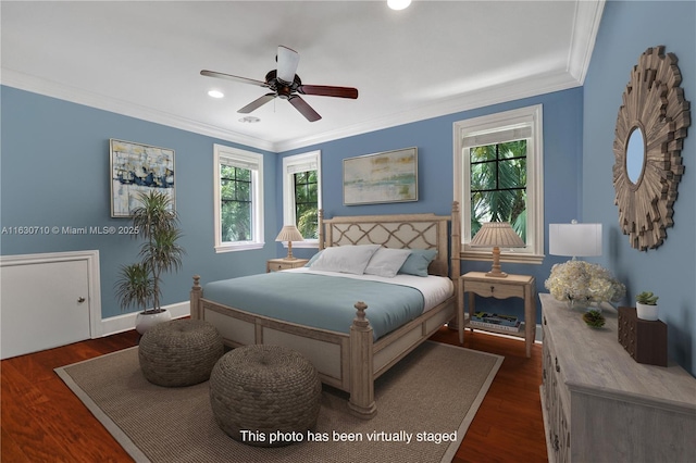 bedroom featuring ceiling fan, dark hardwood / wood-style flooring, and multiple windows