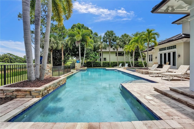 view of swimming pool with a patio