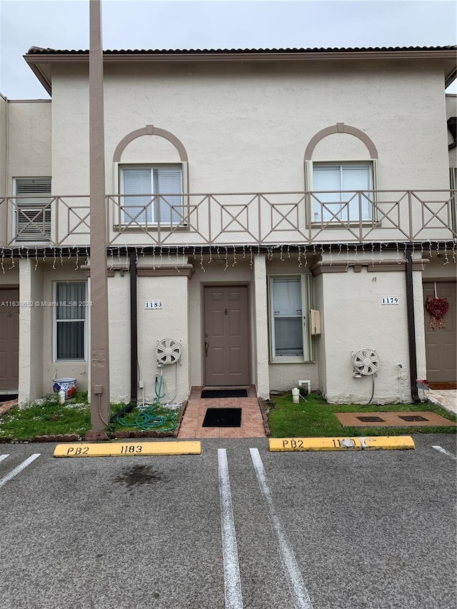 doorway to property featuring a balcony