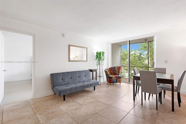 dining space featuring floor to ceiling windows, baseboards, and ornamental molding