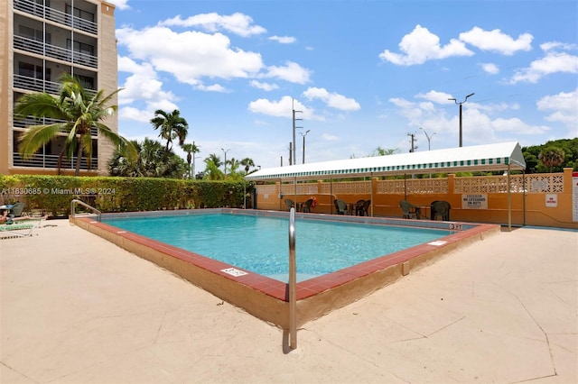 pool featuring fence