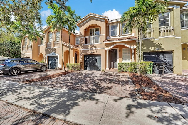 view of front of house with a balcony and a garage