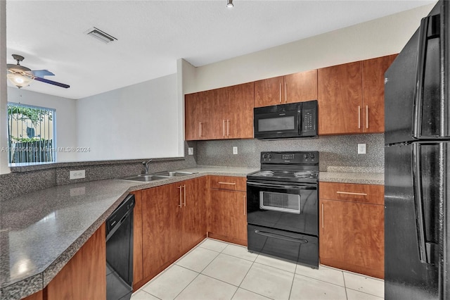 kitchen featuring black appliances, ceiling fan, tasteful backsplash, sink, and light tile patterned floors