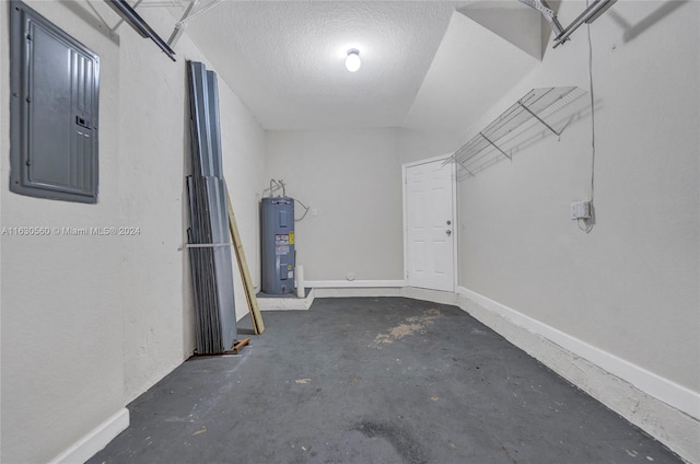 spacious closet featuring electric water heater and electric panel