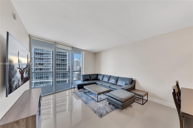 tiled living room featuring expansive windows