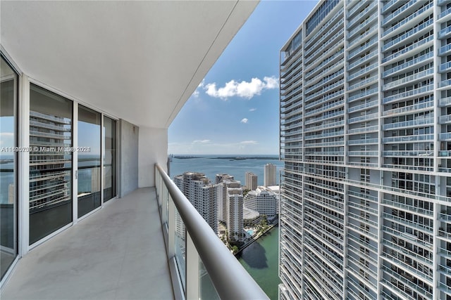 balcony featuring a water view