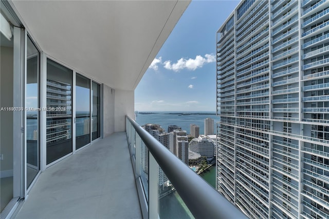 balcony featuring a water view