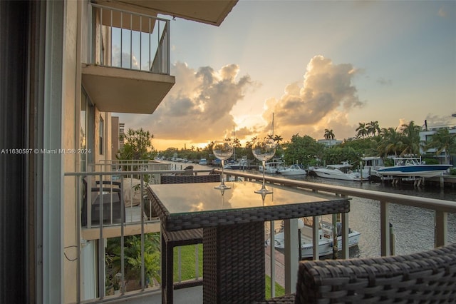 balcony at dusk with a water view