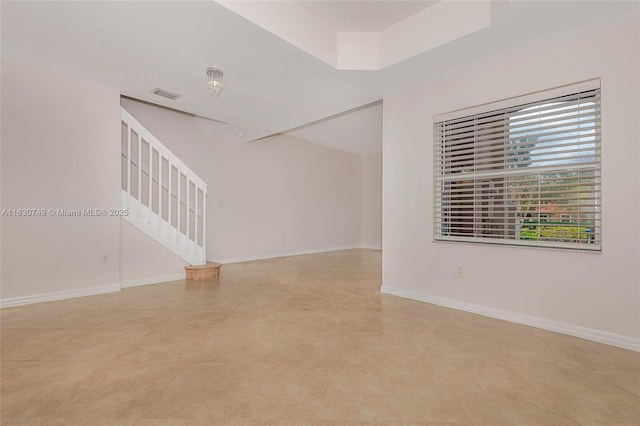 unfurnished room featuring a healthy amount of sunlight and light tile patterned flooring