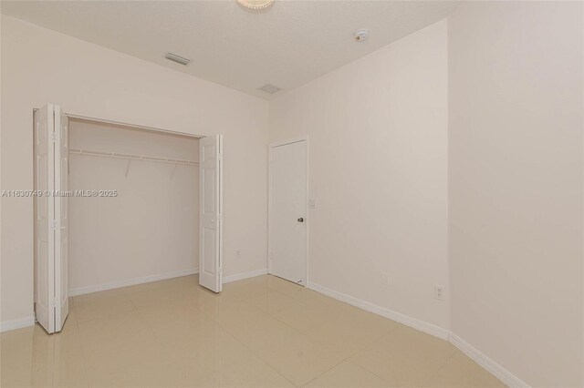 unfurnished bedroom featuring a closet