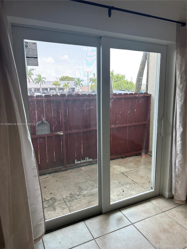 doorway to outside featuring light tile patterned floors