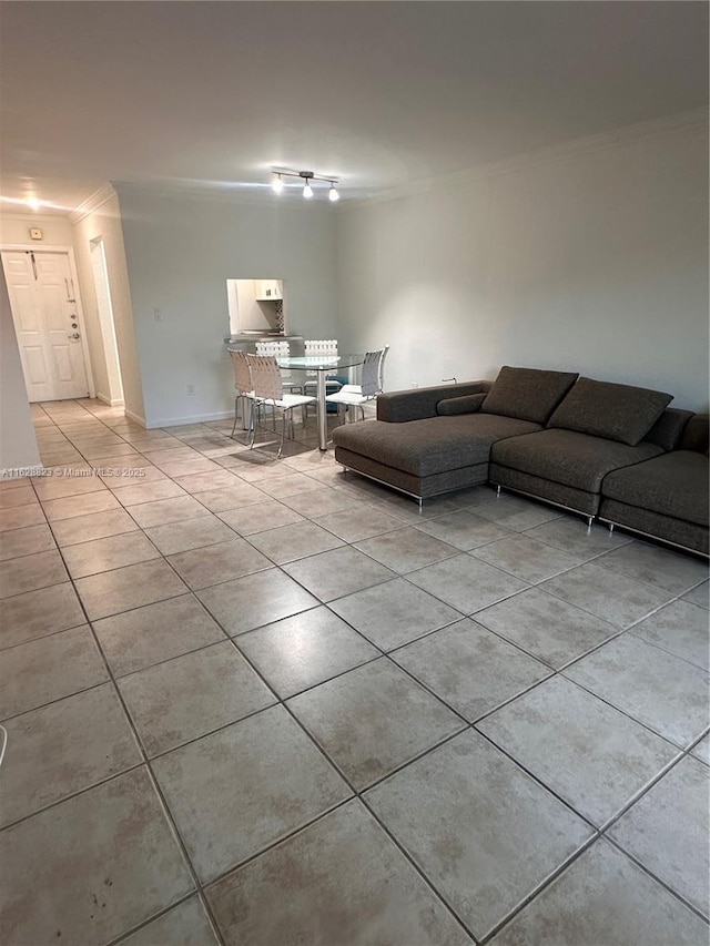 unfurnished living room with light tile patterned flooring and crown molding