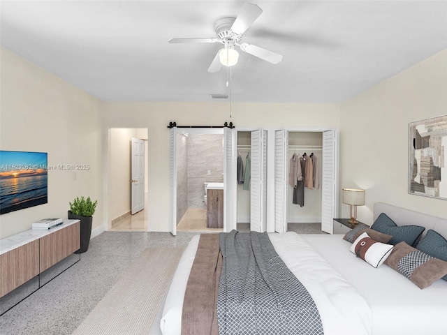 bedroom featuring ceiling fan and two closets