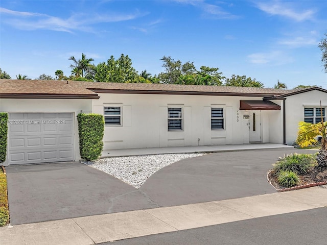 ranch-style home featuring a garage