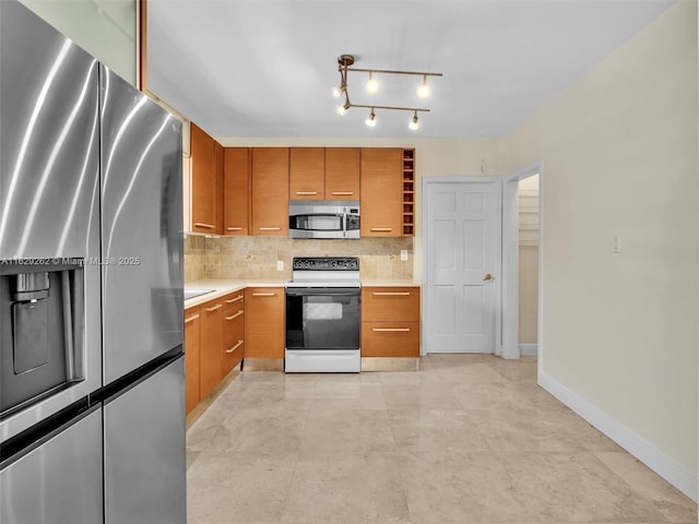 kitchen featuring backsplash and stainless steel appliances