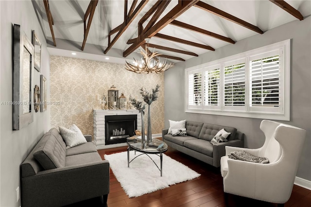 living room featuring dark hardwood / wood-style floors, a notable chandelier, and vaulted ceiling with beams