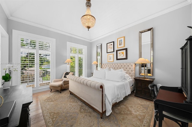 bedroom featuring crown molding and wood-type flooring