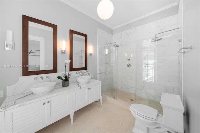 bathroom featuring vanity, toilet, an enclosed shower, and crown molding