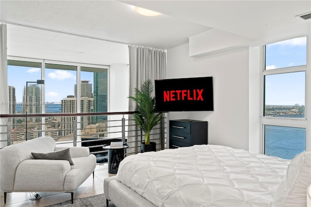 bedroom featuring expansive windows