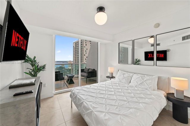 bedroom featuring light tile patterned floors