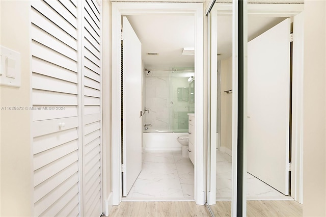 hall featuring light tile patterned floors