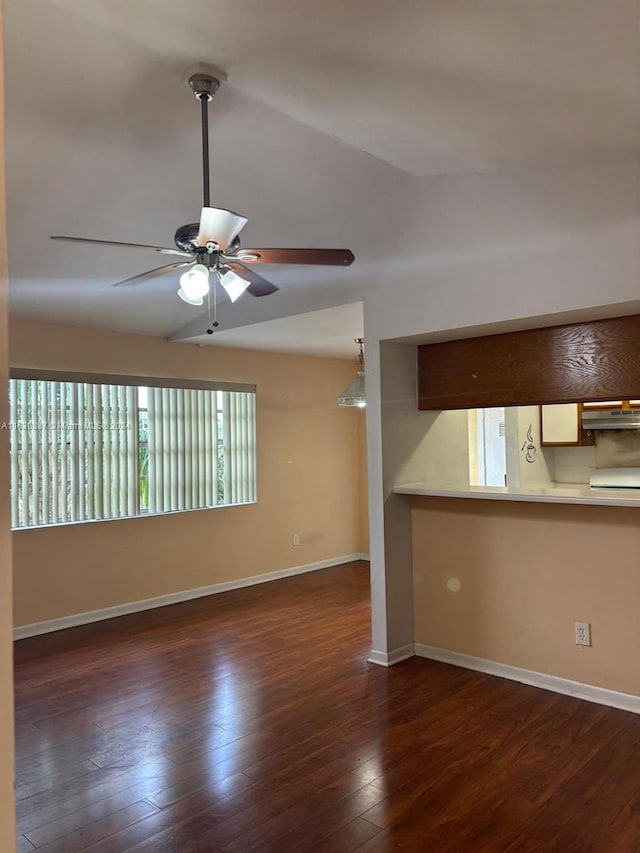 interior space featuring lofted ceiling, dark wood-type flooring, and ceiling fan