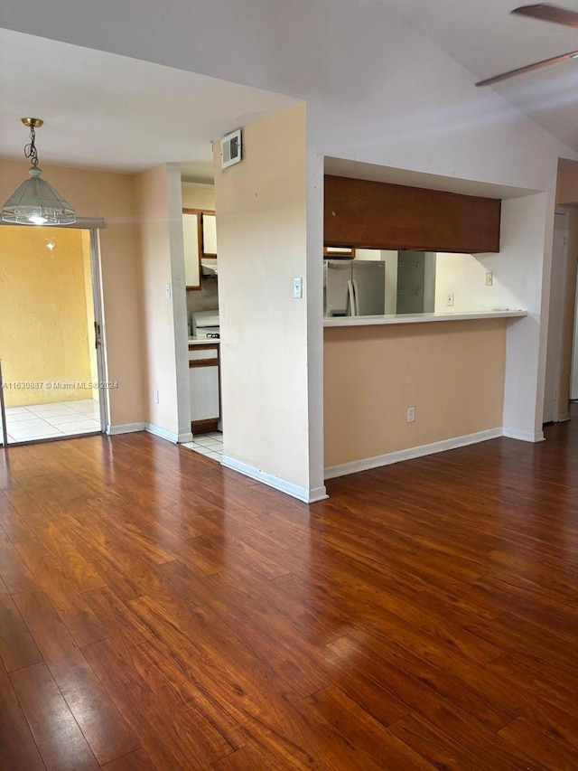 unfurnished living room featuring hardwood / wood-style floors