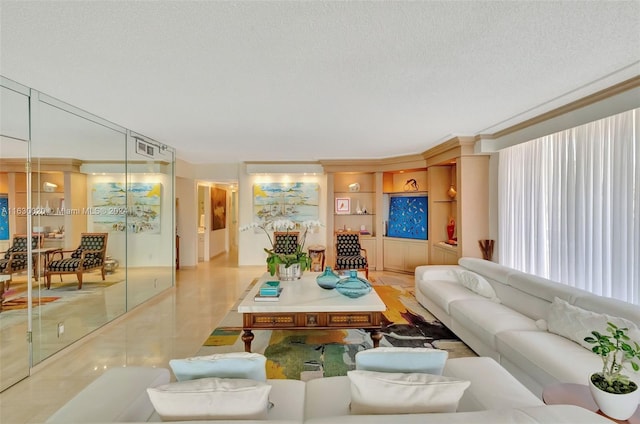 living room featuring crown molding, a textured ceiling, light tile patterned floors, and built in features